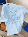 Playera azul oversize con estampado de oso smile every day