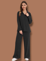 Conjunto tejido de lineas sueter cuello V y pantalon de campana negro