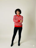 Sueter con estampado de cebra con brillos rojo
