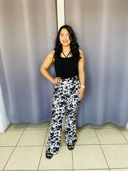 Pantalon con estampado de vaca negro